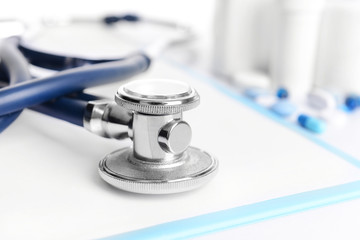 Stethoscope on light background