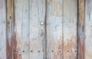 Metal door handle with lock on Vintage door