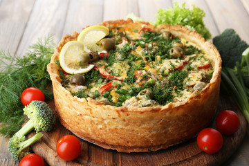 Vegetable pie with broccoli, peas, tomatoes and cheese