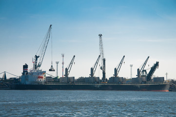 cargo ship loading in coal cargo terminal