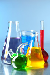 Different laboratory glassware with colorful liquid