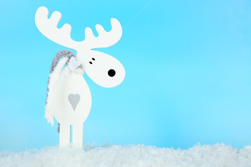 Christmas decoration in shape deer on light blue background