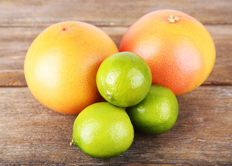 Ripe citrus on wooden background