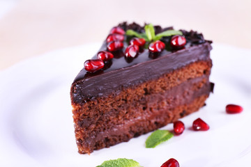 Delicious chocolate cake decorated with pomegranate seeds