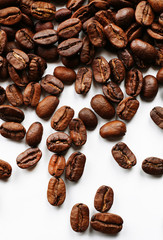 Coffee beans on white table, close-up