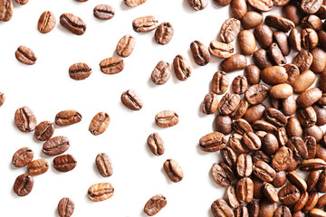 Coffee beans on white table, close-up