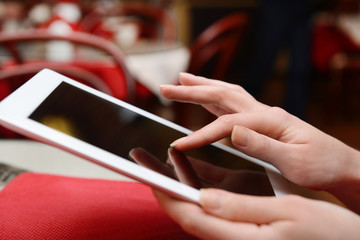 Woman with tablet computer in cafe shop