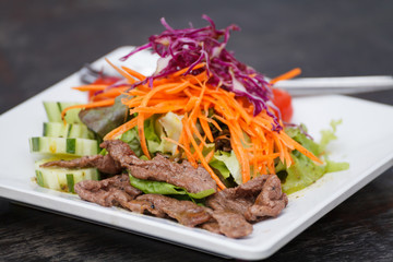Asian Sliced Beef Salad with red cabbage and Carrots