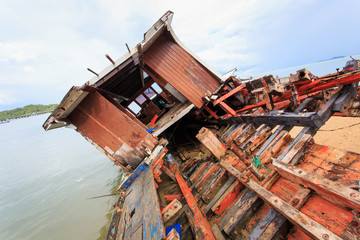 Old wooden boat stand on the beach