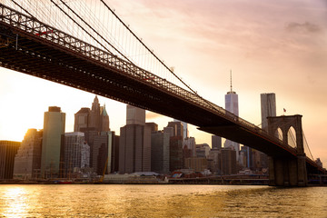 Naklejka na ściany i meble Manhattan skyline with Brooklyn Bridge at sunset, New York City