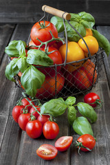 Sweet ripe tomatoes on wooden table