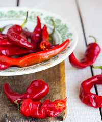 the broken chili peppers on a white background