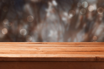 Winter blur background with empty wooden table