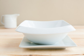 White plates over wooden table