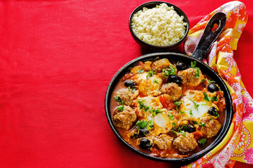 meatballs with olives and egg in tomato sauce