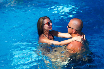 Loving couple in pool