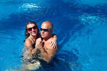 Happy couple in pool