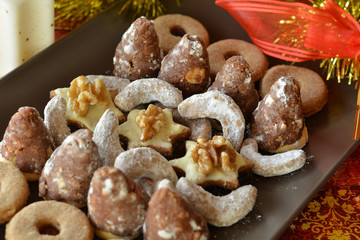 Various Christmas Cookies On The Brown Plate