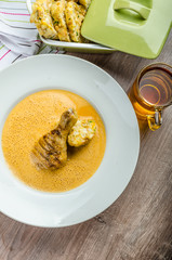 Chicken with red pepper sauce, dumplings