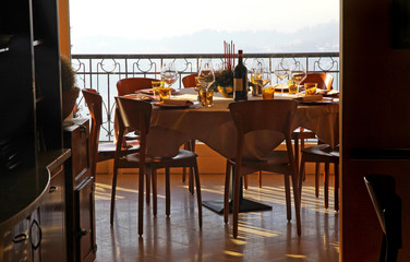 Table with bottle of wine and wine glasses at a restaurant