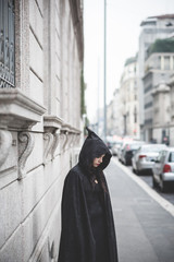 Fototapeta premium beautiful dark vampire woman with black mantle and hood