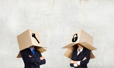 Business people wearing boxes