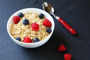 cereal with sweet raspberries and blueberries