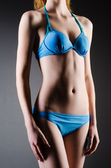 Fototapeta premium Attractive woman in blue bikini