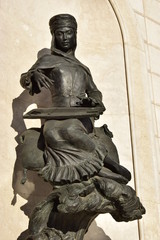 Sculpture featuring a musician playing a Kazakh instrument