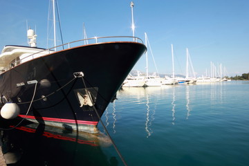 blue Super Yacht Bow in marina	
