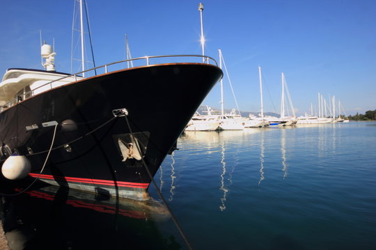 blue Super Yacht Bow in marina	