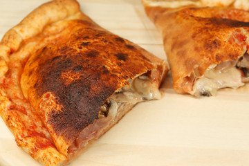 Salty pancake on wooden plate