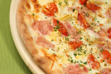 delicious pizza on wooden table