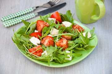Greece salad with mozzarella, ruccola and tomatoes