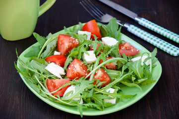 Greece salad with mozzarella, ruccola and tomatoes