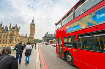 Fototapeta na wymiar Double Decker bus crossing crowded Westminster Bridge