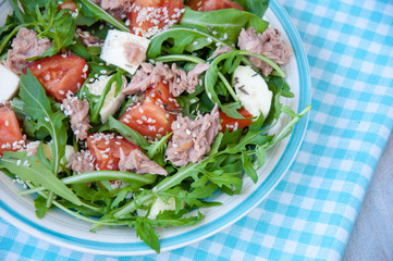 fresh salad with tomatoes, ruccola and tuna