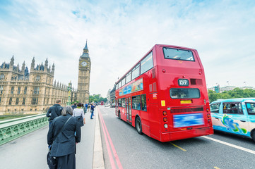 London. Double Decker bus speeding up on Westminster Bridge - obrazy, fototapety, plakaty