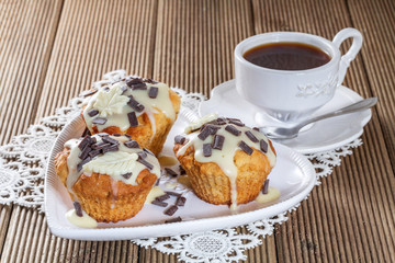 Delicious muffins with chocolate decoration