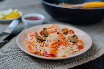 Spanish dish paella with seafood, shrimps in pan