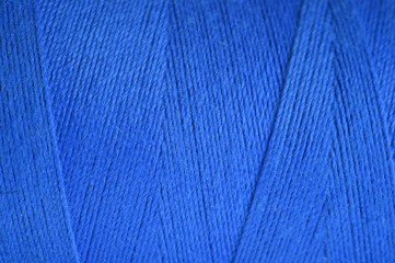 close up shot of blue yarn for background.