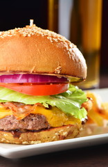 American cheese burger with fresh salad and french fries