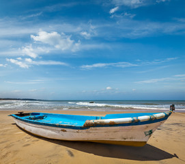 Naklejka na ściany i meble Boat on a beach