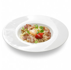 Freshly cooked pasta with salami, ham egg and cheese on a plate