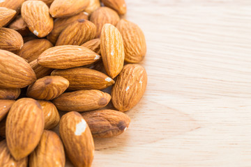 Almond on wooden background