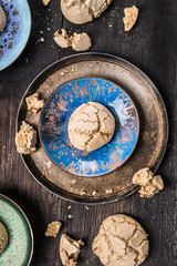 Fototapeta na wymiar Meringues with cracks in vintage bowls, top view