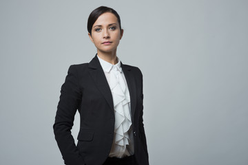 Confident strong businesswoman posing