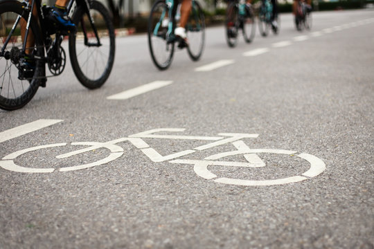 Bicycle sign or icon and movement  of cyclist in the park