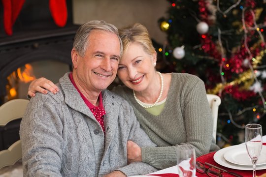Portrait of smiling mature couple at table