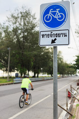 Bicycle sign or icon and movement  of cyclist in the park